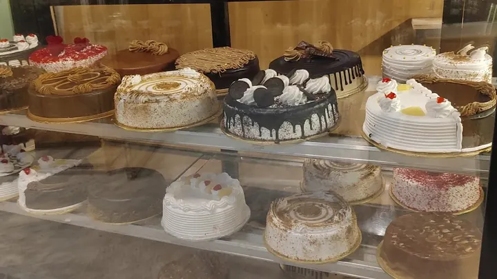 The Cake Talk display counter filled with cakes and pastries